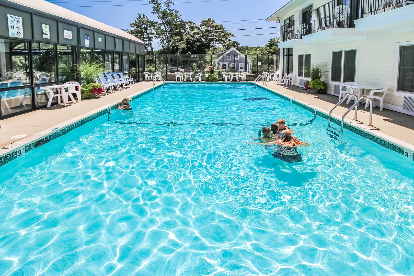 a refreshing pool at VRI's Holly Tree Resort in Massachusetts.